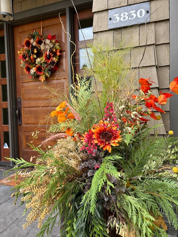 Fall planter enhancing a beautiful front entry